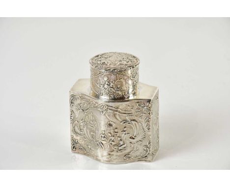 An imported hallmarked silver tea caddy of bellied form, embossed with Continental figures in landscape scenes, approx 4ozt/1