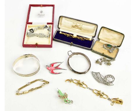 A quantity of costume jewellery including silver gilt bracelet, hallmarked silver snap bangle, further bracelets, brooches et