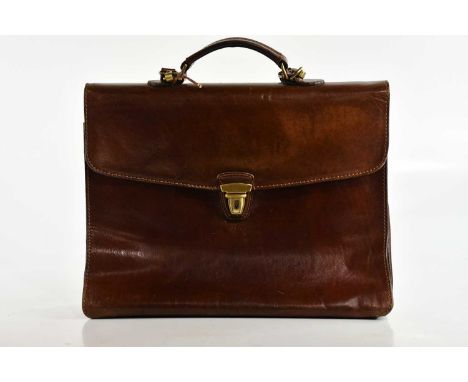 THE BRIDGE; a large tan leather briefcase, with top handle, long detachable shoulder strap, brass hardware, front snap lock e