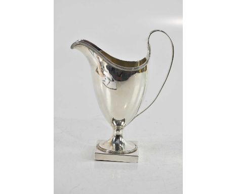 PETER &amp; ANN BATEMAN; a large George III helmet shaped hallmarked silver cream jug, on square plinth base, London 1793, he