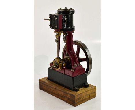 A large scratch built live steam vertical engine, marked S, on wooden plinth base, height 39cm. 