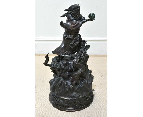 A Japanese Meiji period two sectional bronze figure representing a bearded male holding a malachite effect Pearl of Wisdom ab