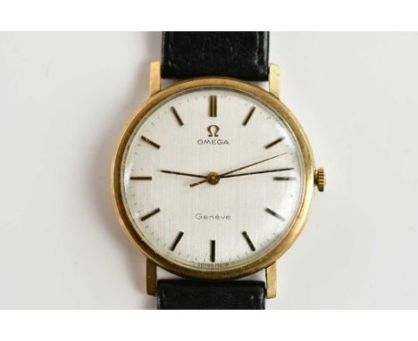 OMEGA; a gentleman's yellow metal cased wristwatch, the silvered dial set with batons and signed 'Omega, Geneva', diameter 30