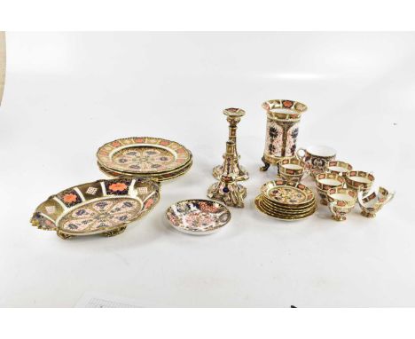 ROYAL CROWN DERBY; a mixed collection of Imari pattern ceramics including cups and saucers, dinner plates, pair of candlestic
