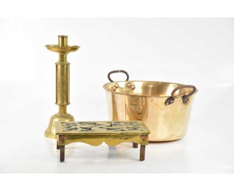 A 19th century flat bottom preserve pan, with twin copper riveted steel handles, a pierced rectangular brass trivet and a bra