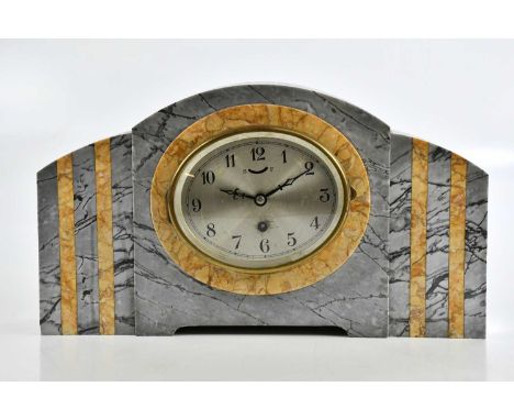 A 1930s marble mantel clock with silvered dial set with Arabic numerals, height 23cm.