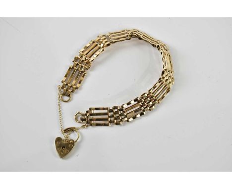 A 9ct yellow gold gate link bracelet with padlock clasp, approx 16.2g. 