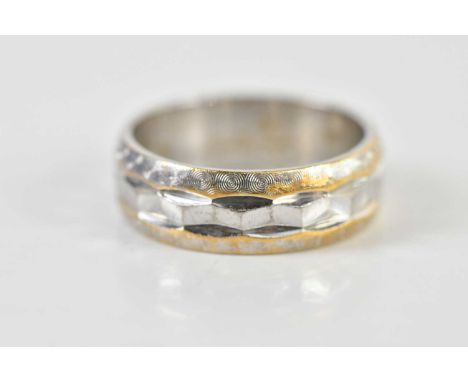 An 18ct white gold wedding band, size K, approx 5.5g.