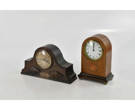 An Edwardian inlaid mahogany mantel clock, height 21cm, and a 1920s oak mantel clock (2). 
