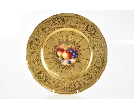 ROYAL WORCESTER; a hand painted and gilt decoration cabinet plate, with scalloped edge and floral decoration outside the cent