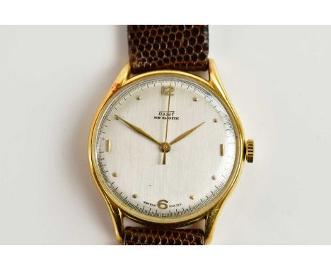 TISSOT; an 18ct gold cased New Magnetic wristwatch, the silvered dial set with half Arabic numerals and batons, diameter excl