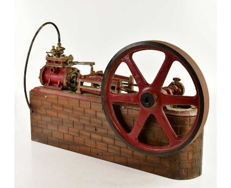 A large scratch built live steam single piston engine, on wooden plinth, height 43cm, length 70cm.