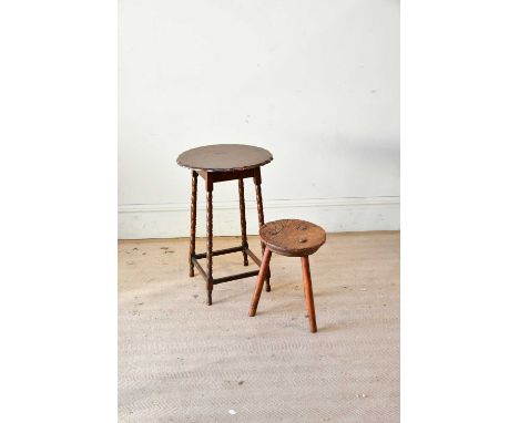 A 1920s oak occasional table with scalloped edge, on bobbin legs, and a 19th century elm stool (2).