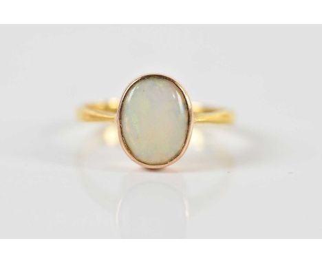 A 22ct yellow gold opal set ring, size K 1/2, approx 2.4g.