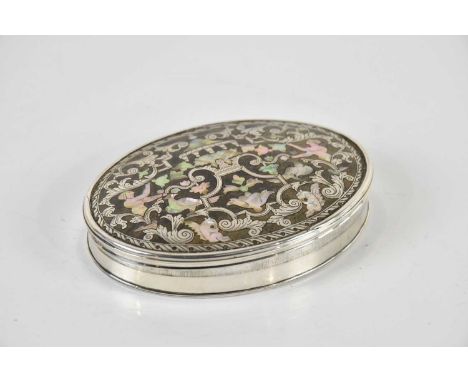 A 19th century mother of pearl inlaid white metal snuff box of oval form, with faux tortoiseshell top and base, 6 x 8cm.