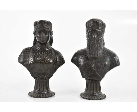 A pair of late 19th/early 20th century Assyrian style bronze busts modelled as male and female, height 17cm (2).