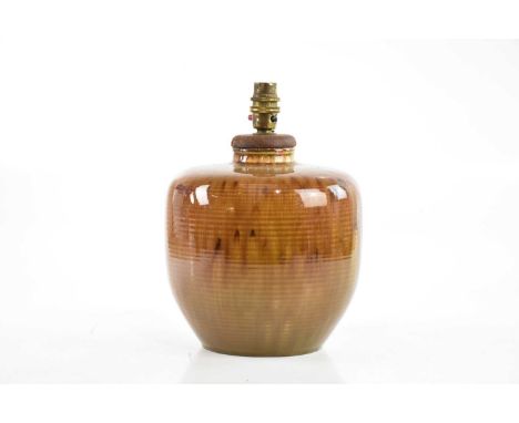 NORMAN WILSON FOR WEDGWOOD; a large art pottery vase, with ribbed decoration and a brown glaze, impressed marks and initials,