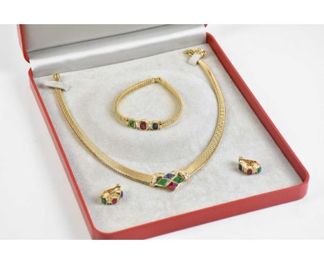 CHRISTIAN DIOR; a vintage jewellery set comprising a gold tone necklace set with green, red and blue stones and crystals, len