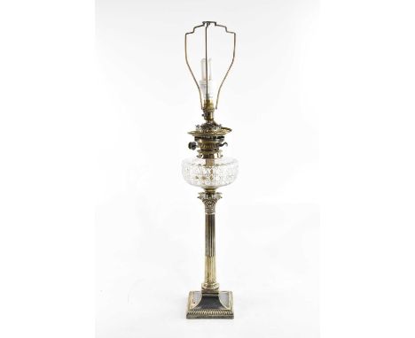 A Victorian silver plated oil lamp, with cut glass reservoir, on a Corinthian column stand, height including fitting 57cm (co
