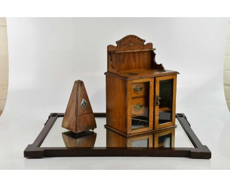 An early 20th century smokers cabinet, with two glazed doors, height 41.5cm, width 29cm, a metronome, and a early 20th centur