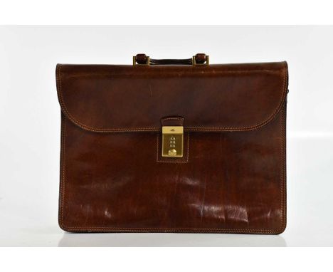 THE BRIDGE; a large tan leather briefcase, with brass front combination lock closure, top handle, back zip pocket, three inte