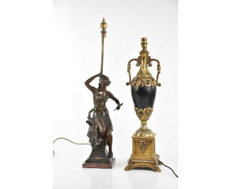 A bronzed figure, 'Printemps', after Drouot, converted to a table lamp, and a reproduction urn form gilt metal and black bodi