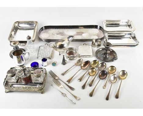 A collection of 19th century and later silver plate including a desk stand, with taper stick and two inkwells above the recta