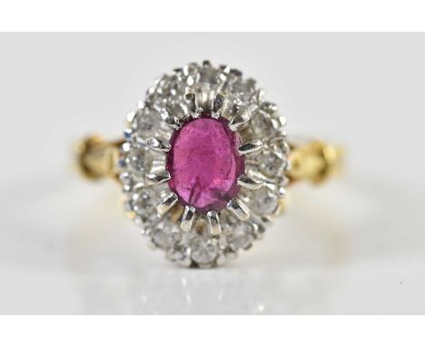 An 18ct yellow gold diamond and ruby oval floral cluster ring, size Q 1/2, approx 6.4g.