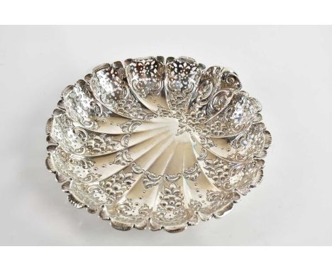 JAMES DIXON & SONS; a George V hallmarked silver shell shaped dish with pierced and repousse decoration, Sheffield 1910, diam