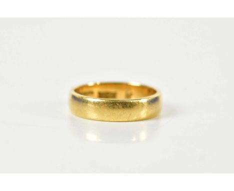 A 22ct yellow gold wedding band, size K, approx 4g.