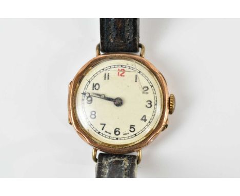 A vintage 9ct yellow gold wristwatch, with Arabic numerals to the circular dial.