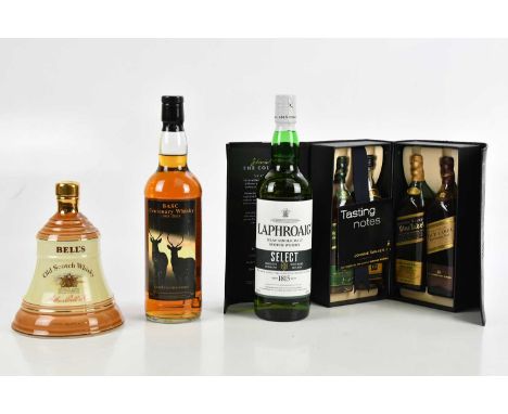 WHISKY; a bottle of Laphroaig Islay single malt Scotch whisky, a collection of four Johnnie Walker 20cl bottles, boxed with t