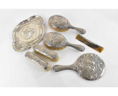 S M LEVI LTD; an Edward VII hallmarked silver seven piece dressing table set comprising shaped tray, approx 6.6ozt/207g, two 