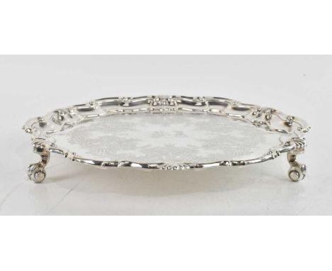 JAMES DIXON &amp; SONS; a Victorian hallmarked silver salver, with scalloped edge and chased decorated centre, with family cr