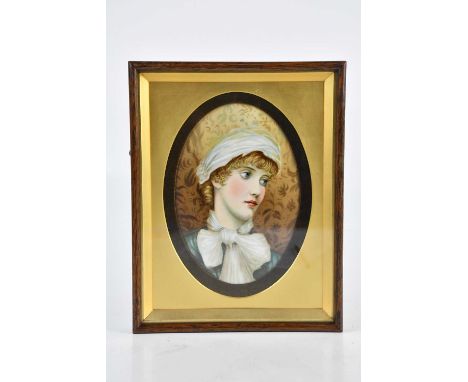 A 19th century hand painted porcelain plaque of oval form, depicting a maiden wearing a bonnet and scarf, signed 'B. R. R', 2