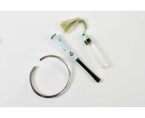 An early 20th century glass perfume bottle, with sterling silver and green guilloché enamel stopper, height 6cm, a white meta