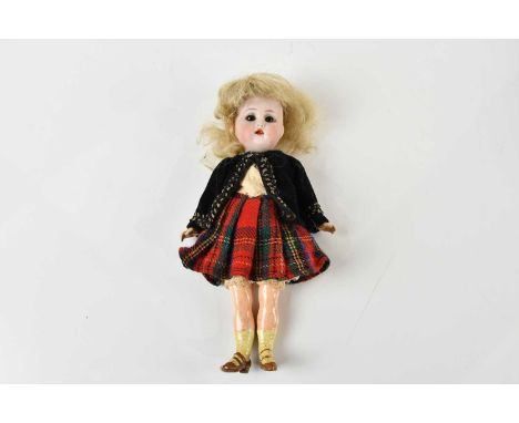 KAMMER &amp; REINHARDT; a small size bisque head doll, with composition arms and legs with moulded and painted shoes, length 
