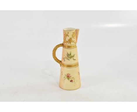 A Royal Worcester blush ivory ewer of tapering form, height 22cm.
