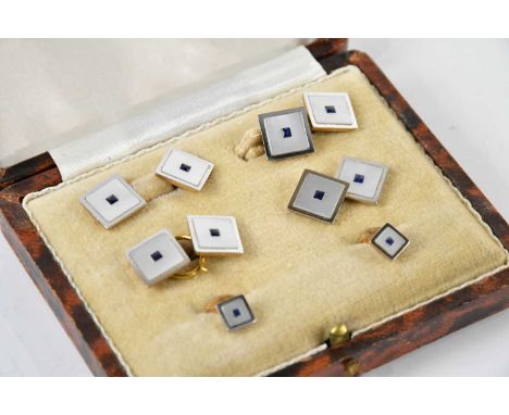 A cased set of mother of pearl and sapphire centred cufflinks and button studs, each inscribed 'Platinum &amp; Gold' to the r