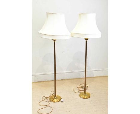 A pair of decorative brass standard lamps with shades.Condition Report: The item or items in this lot are sold as decorative 