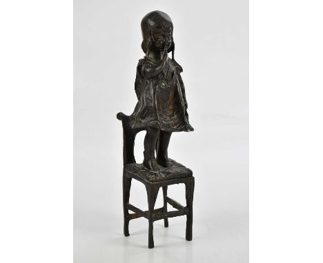 MENE; a bronze figure of a young girl standing on a chair, height 30cm.
