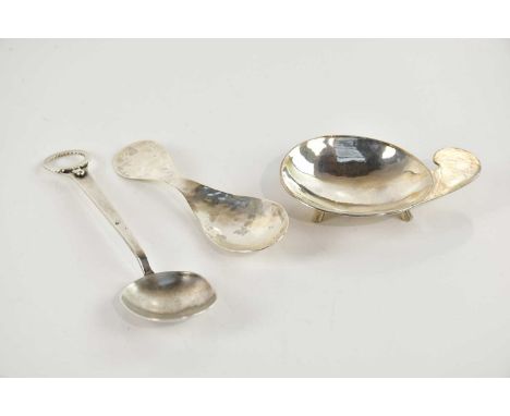 JOHN CRAWFORD ADAMS; an Elizabeth II hallmarked silver brutalist style pipe stand with planished decoration on three feet, Lo