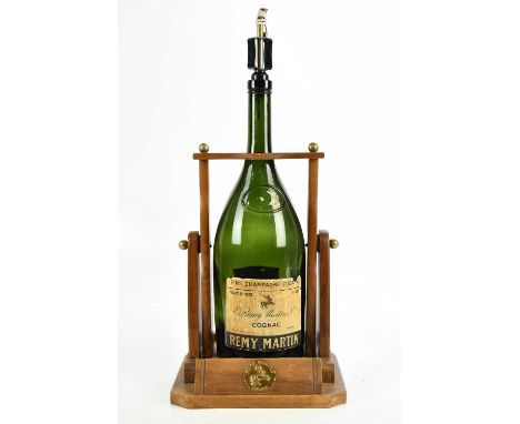 COGNAC; a single empty magnum bottle of Remy Martin &amp; Co Cognac, housed in a Remy Martin bottle stand. 