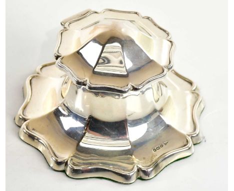 WALKER &amp; HALL; a George V hallmarked silver octagonal shaped Capstan style inkwell with panelled and scalloped shaped bor