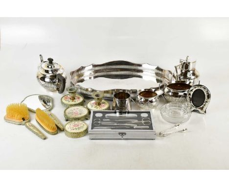 A collection of assorted silver plate including a twin handled gallery tray, three piece Mappin &amp; Webb tea service, vanit