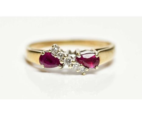 A 9ct yellow gold ruby and diamond ring, size O, approx 2.1g, presented with Beaverbrooks card.
