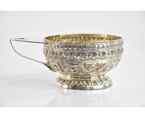 GEORGE NATHAN &amp; RIDLEY HAYES; a George V hallmarked silver bowl with side handle, cast decoration of scrolling detail and