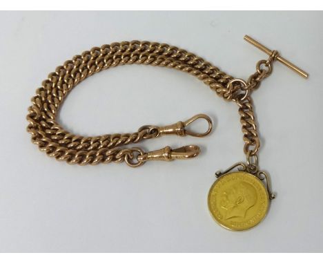 A 9ct rose gold Albert chain with George V 1913 gold sovereign, approximately 59.5g total weight.
