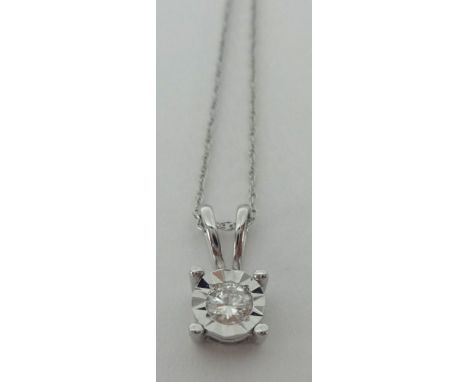 A diamond pendant necklace, set with single round cut stone, in 14k white gold, on fine chain.