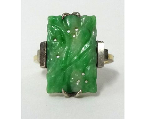 A jade ring set in yellow gold, size, N.